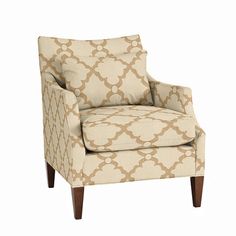 a beige and white patterned chair with wooden legs