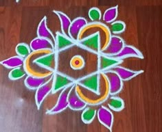 a colorful flower design is on the floor