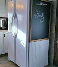 a white refrigerator freezer sitting inside of a kitchen