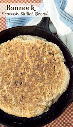 a skillet with some food in it on top of a red and white checkered table cloth