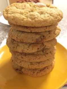 a stack of cookies sitting on top of a yellow plate