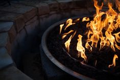 a fire pit filled with lots of flames