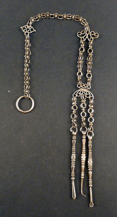 Antique Chinese silver chatelaine pendant with a grooming kit. They are also worn by some Chinese minorities groups like the Lahu, Akha and Lisu. This type of chatelain is often suspended from a loop on the shoulder or from the back of a neck ring. From the beginning of the XXth Century. This genuine silver jewellery from China is more and more difficult to find. The pendant measures 30 cm high (11,81 in). It weighs 20 gr. (SEA170) If sold outside of the EU, the buyer is responsible for paying i Three Necklaces, Neck Ring, Chinese Jewelry, Chatelaine, Grooming Kit, Ethnic Jewelry, Antique Jewellery, Chains Necklace, Silver Jewelry