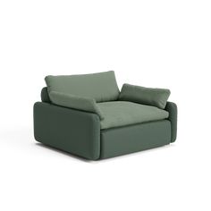 a green chair sitting on top of a white floor