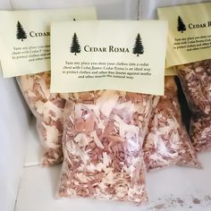 three bags of cedar roma sitting on top of a white counter next to each other