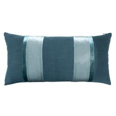 a blue and white striped pillow on a white background with a green stripe down the middle