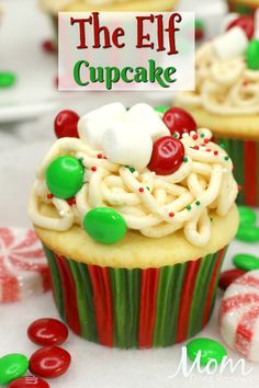 the elf cupcake is decorated with candy and sprinkles