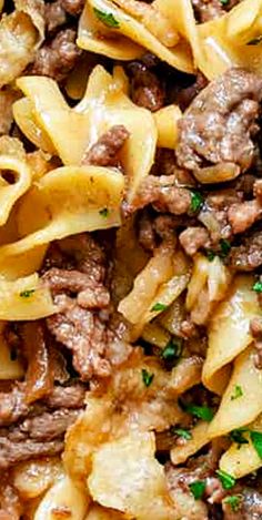 pasta with ground beef and parsley in a white bowl