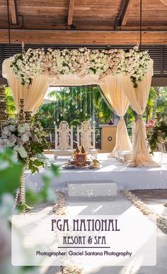 an outdoor wedding setup with flowers and greenery