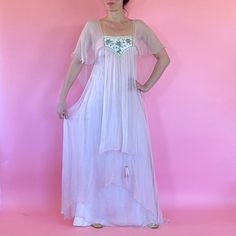 "1970s Pink Chiffon Ethereal dress by Shuji Tojo made in England. Made of Pink Silk Chiffon with Cream Colored Lining with Silver Beaded and Sequins Yolk and a Feather Tassel. A Off Shoulder Design with Flowing Layers of Chiffon, she is a Ethereal Dream.  Size: Small-Medium Bust: 32\" Waist and Hips: 40\" Length: 62\" Condition: Good - Great Fabric is in Great Condition, Strong and Sturdy.  Small Hole Found at Hem and a Few Faint Spots. Please Message me any questions before Purchasing as this I Flowy Vintage Chiffon Dress, Vintage Sheer Chiffon Dress, Vintage Silk Chiffon Summer Dress, Vintage Silk Chiffon Dress For Summer, Bohemian Silk Dress With Sheer Details, Bohemian Silk Sheer Dress, Bohemian Sheer Silk Dress, 1970s Style Summer Floor-length Dresses, 1970s Style Floor-length Summer Dresses