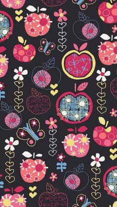 an apple and flower pattern on a black background