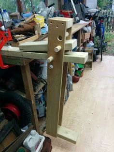 a woodworking bench in a garage with tools on the table