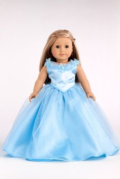 the doll is wearing a blue dress