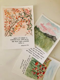 four cards with watercolors on them, one has a tree and the other has flowers