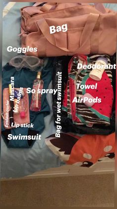 the contents of a travel bag sitting on top of a bed next to each other