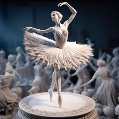 a white ballerina statue standing on top of a table surrounded by figurines