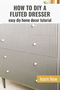 a grey dresser with white knobs on it and the words how to diy a fluted dresser