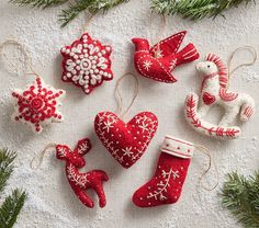 christmas ornaments are arranged on a table