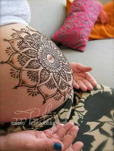 a woman's belly with henna on her stomach and the words, reuse belly henna article from flickr