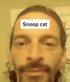 a man with the word snoop cat on his forehead