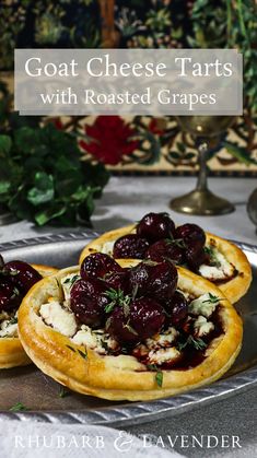 goat cheese tarts with roasted grapes on a platter