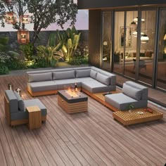 an outdoor living room with wood flooring and furniture