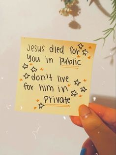 someone holding up a piece of paper that says jesus died for you in public don't live for him in private