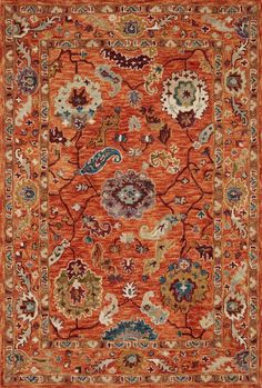 an orange rug with many different colors and designs