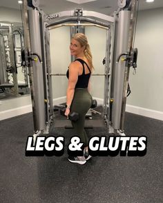 a woman is doing squats and glutes in front of a gym machine