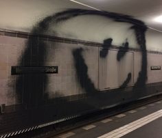 graffiti on the wall of a subway station