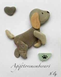 a card with a dog on it and some rocks in the shape of a heart