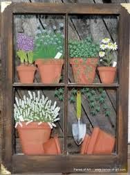 an old window is filled with potted plants