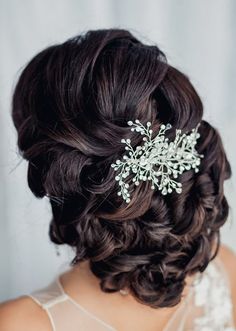 a woman wearing a bridal hair comb