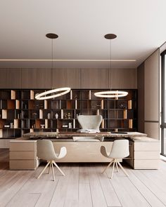 an office with two chairs and a desk in front of a book shelf filled with books