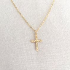 Simple Gold Filled Cross Necklace, First Communion Necklace, Baby Baptism Necklace, Confirmation Necklace, Everyday Necklace, Mom NecklaceAvailable in 14K Gold Filled ONLY.Specification. All component is 14K Gold Filled NOT plated. Cross size 10.2 x 16.4mm. Comes in a satin pouch. Length includes jump ring and claspIMPORTANT:Usually jewellery in the pictures looks bigger than in reality.Please consider all given dimension and compare them to the ruler before ordering.More collections of Religiou Yellow Gold Cross Necklaces For Baptism, Gold Cross Pendant Necklace For Baptism, Gold Cross Jewelry For Baptism, Dainty Cross Necklace For Baptism, Spiritual Cross Pendant Necklace For First Communion, Adjustable Crucifix Necklace For Gift, Gold Cross Pendant Necklace For First Communion, Dainty Adjustable Jewelry For Baptism, Gold Cross Pendant Jewelry For Baptism