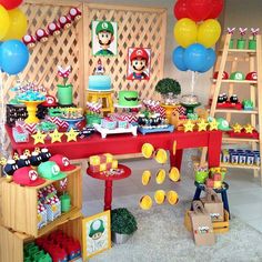 a mario birthday party with balloons and decorations