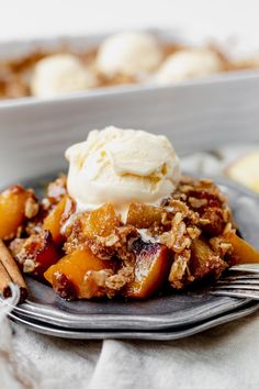 a close up of a plate of food with fruit and ice cream on the top