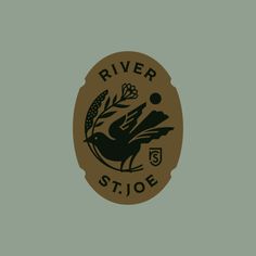 the river stoe logo is brown and black on a green background with an oval shape