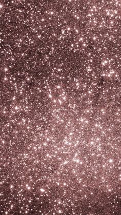 an image of some pink glitter in the air with stars all over it and on top of them