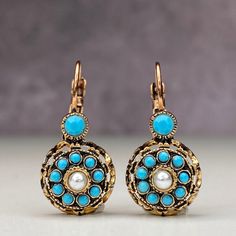 We loved our rose model imitation diamond earrings from the Ottoman period and enjoyed making them. We both brought back an element of our culture and that reminds us the past. We tried to create a diamond look with turquoise crystal stones in our Ottoman rose model imitation diamond bronze earrings. In our Anatolian culture, we used to see these earrings in our grandmothers at a young age, and they were handed down to our mother as a legacy from them and later to us. We are currently trying to Turquoise Brass Earrings, Ornate Bronze Earrings, Elegant Turquoise Nickel-free Flower Earrings, Elegant Turquoise Flower Earrings Nickel Free, Antique Blue Earrings, Vintage Turquoise Round Earrings, Rosé Model, Bronze Earrings, Turquoise Crystal