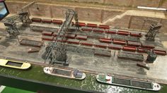 an aerial view of some boats in the water and one boat sitting on top of another