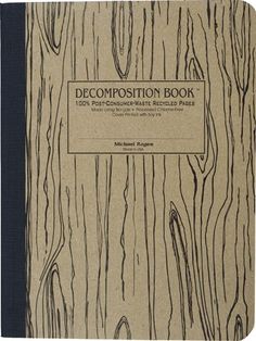 the decompositionion book is open to show woodgrain and black lines