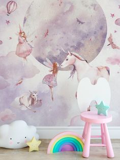 there is a wall mural with unicorns and stars in the sky on this child's room