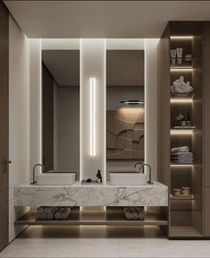 a bathroom with marble counter tops and two sinks