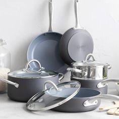 several pots and pans on a counter top