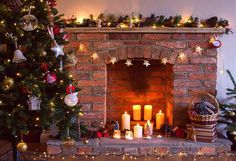 a decorated christmas tree in front of a fireplace with lit candles and presents on the mantle