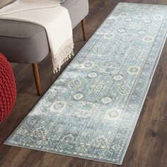 a large blue rug in a living room