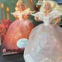 the barbie doll is wearing a white dress and tiara with sequins on it