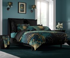 a bed room with a neatly made bed and blue walls