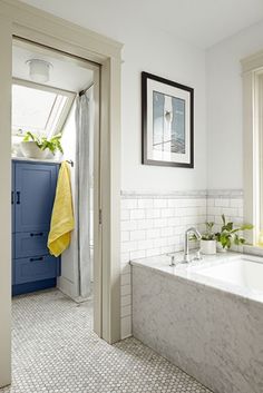 a bath room with a tub and a window